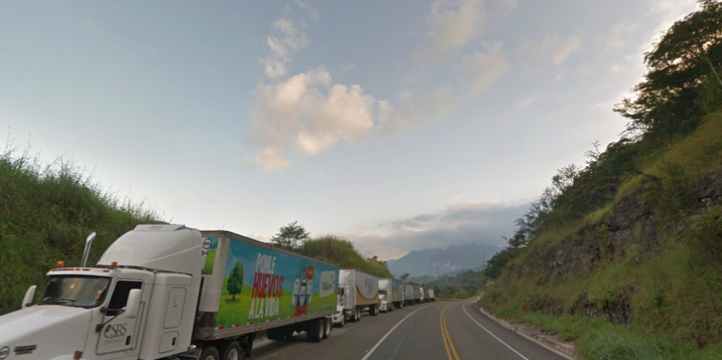 Bob LaGarde - Road trip through Central America - Truckers cooling their brakes before heading down the next stretch of the mountain roads coming from Tuxtla